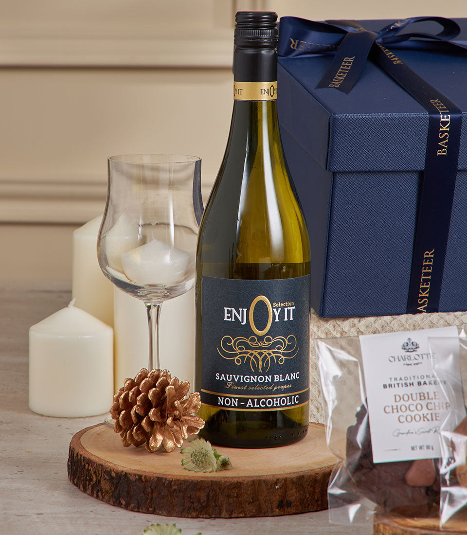 Premium non-alcoholic Sauvignon Blanc gift set with dark blue Basketeer box, gourmet cookies, and festive New Year