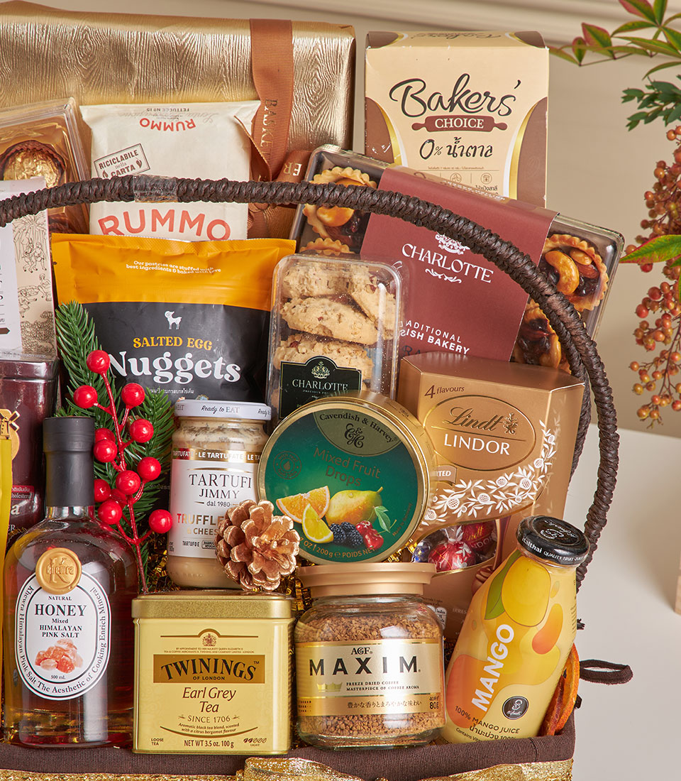 Luxe New Year gift hamper with gourmet chocolates, fine foods, and artisan treats in woven basket