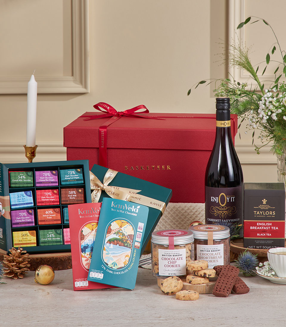 Luxe New Year hamper with gourmet chocolates, Cabernet wine, British tea, and artisan cookies in red gift box