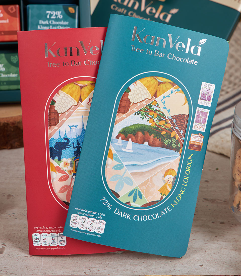 Kanvela Tree to Bar chocolate bars in red and teal packaging with Thai-inspired artwork, New Year luxury gift hamper