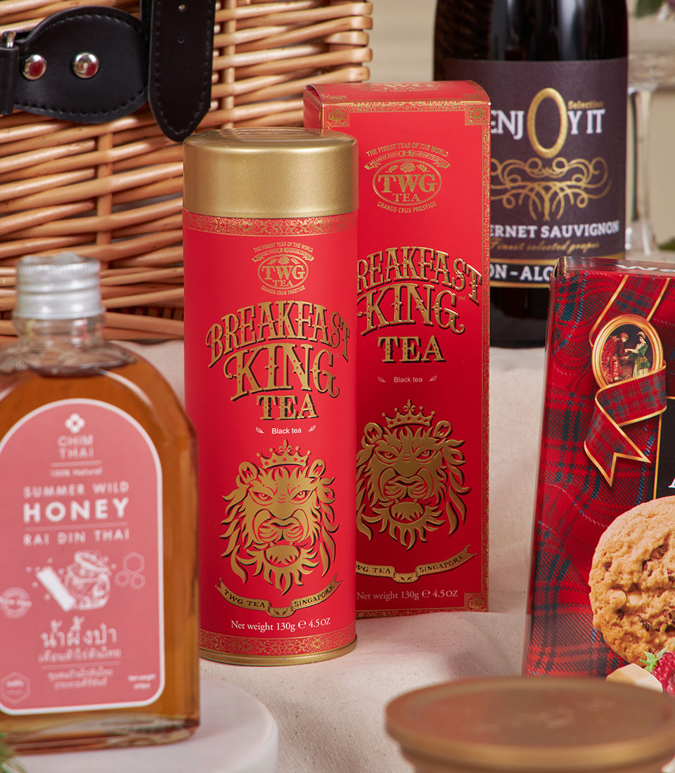 Red luxury gourmet hamper with Thai honey, premium tea, wine, and raspberry white chocolate cookie for New Year celebration