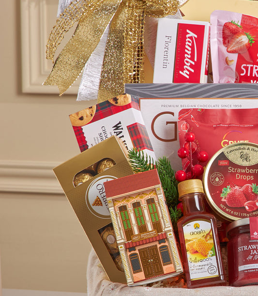 Luxury gourmet hamper with gold chocolates, artisan cookies, honey, and jam in woven basket with festive gold bow