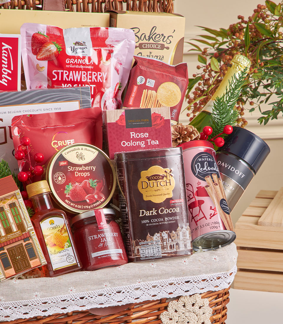 Deluxe wicker hamper with champagne, gourmet chocolates, tea, and artisan snacks for New Year celebrations