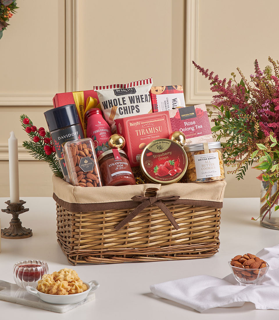 Woven wicker hamper with gourmet treats, bird's nest, tiramisu, cookies, tea, and Davidoff fragrance for New Year gifting