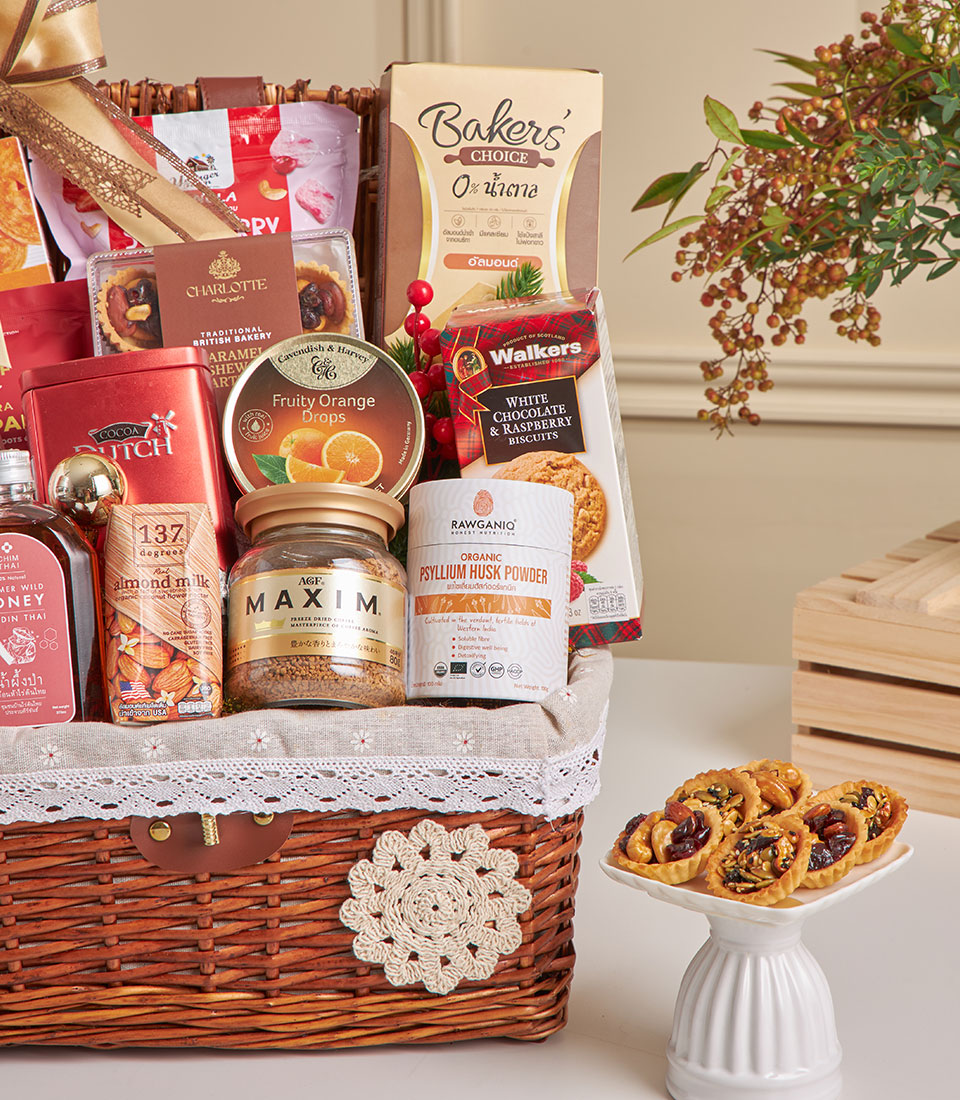 Premium almond crackers and gourmet treats gift basket with white lace trim, perfect for New Year gifting