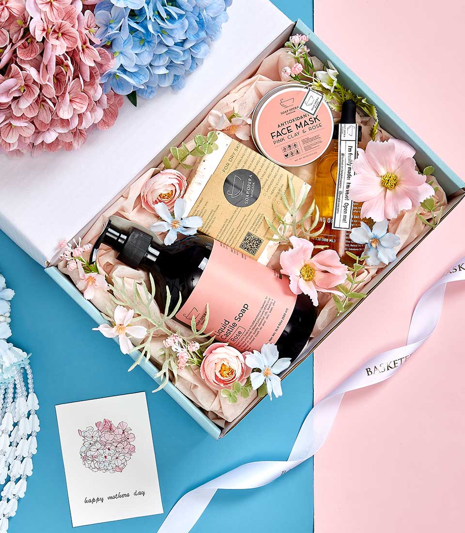 Light blue luxury spa gift box with rose castile soap, clay face mask, and artisan skincare for Mother's Day