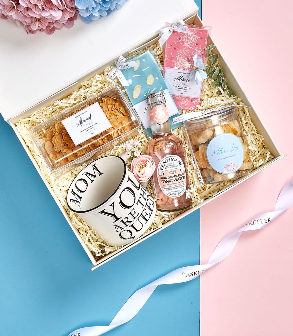 Mother's Day gift set with ceramic mum mug, almond cookies, chocolate bars, and pineapple cookies in luxury white box