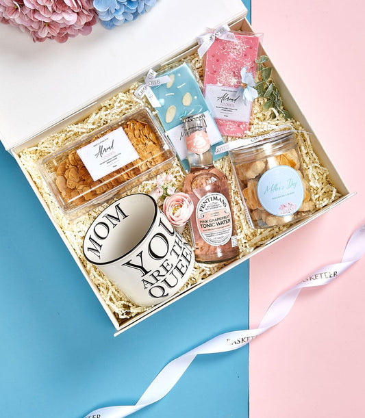 Mother's Day gift set with ceramic mum mug, almond cookies, chocolate bars, and pineapple cookies in luxury white box