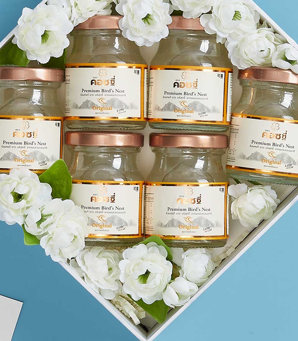 Premium bird's nest gift set with six rose gold jars in white box, adorned with white jasmine flowers for Mother's Day