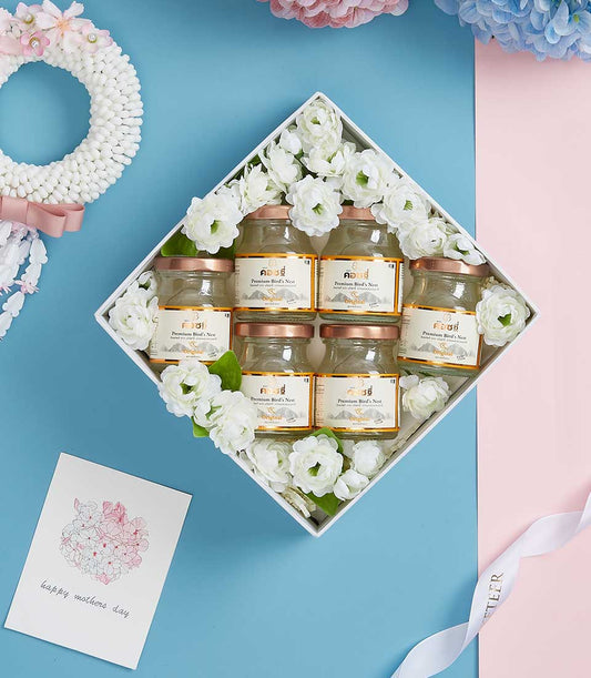 Premium bird's nest gift set with six jars, white box, jasmine flowers, and Mother's Day card