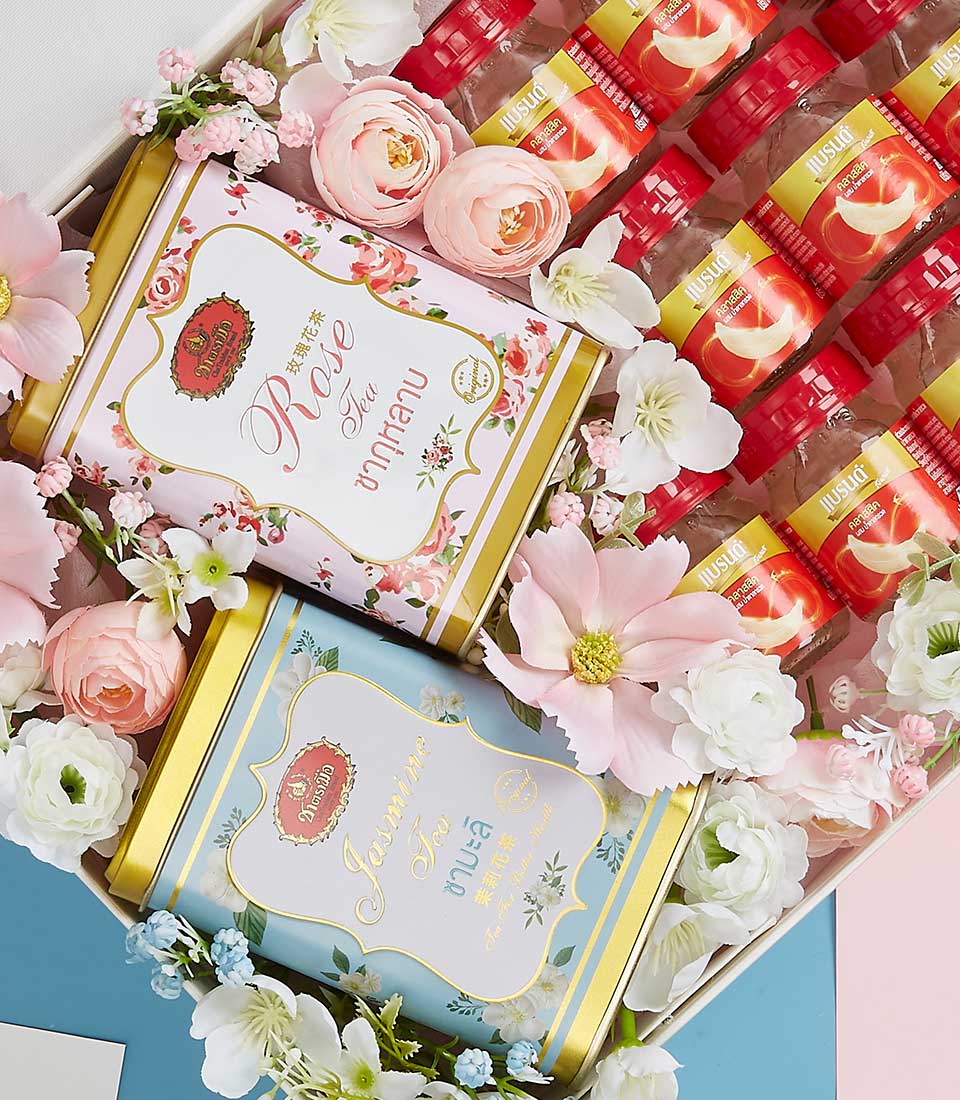 Luxury Mother's Day gift basket with rose and jasmine tea, premium bird's nest bottles, and pink silk flowers
