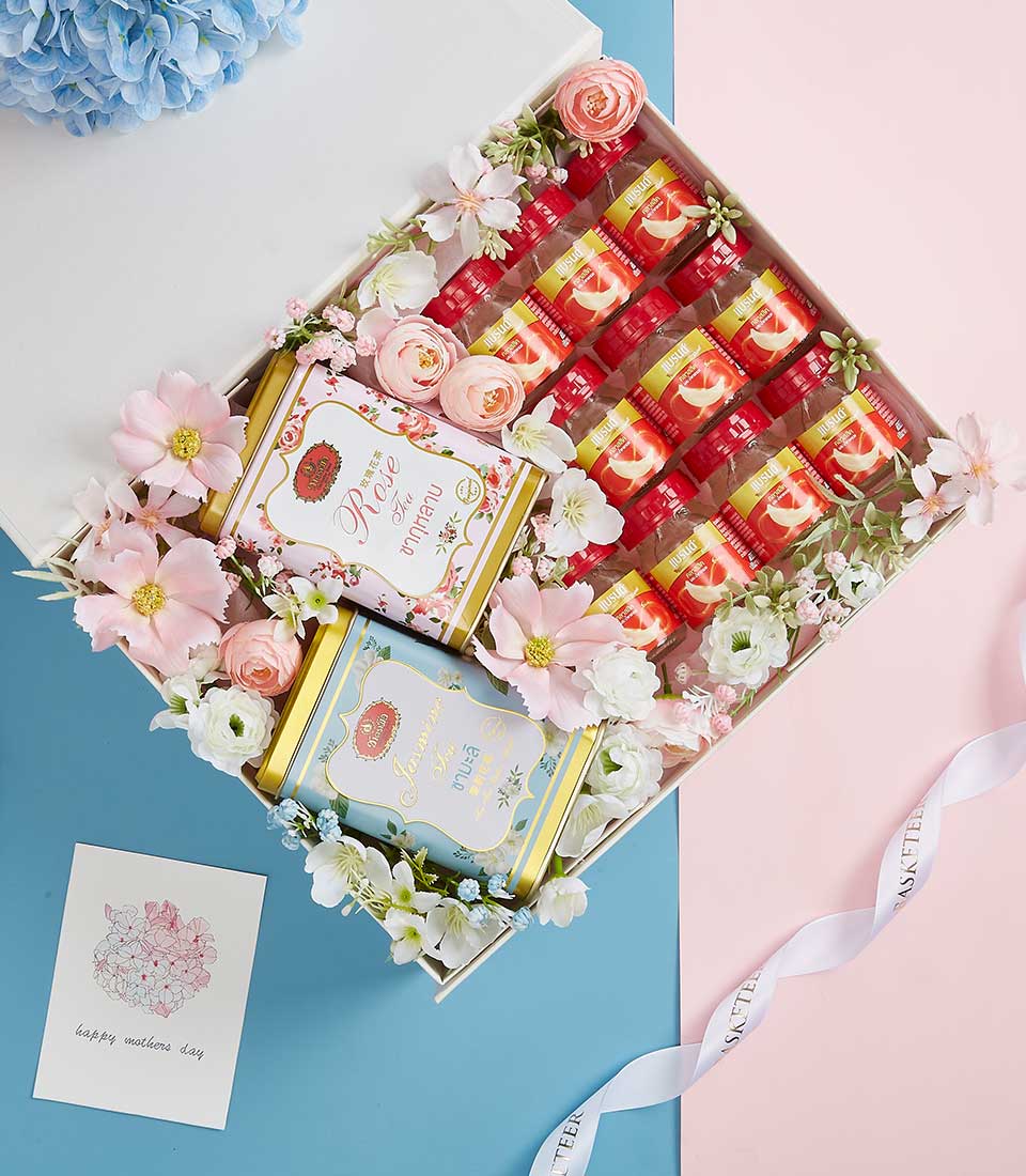 Premium Mother's Day gift basket with bird's nest bottles, rose and jasmine tea, and fresh florals