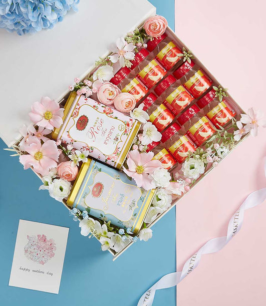 Premium Mother's Day gift basket with bird's nest bottles, rose and jasmine tea, and fresh florals