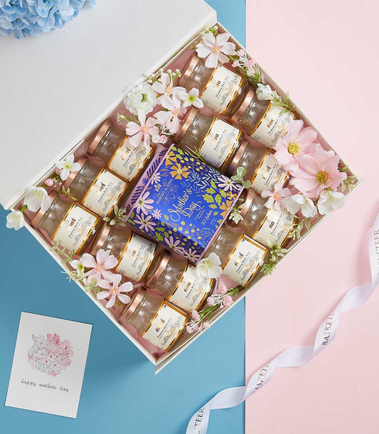 Deluxe premium bird's nest gift box with twelve glass jars, white and gold labels, decorative flowers for Mother's Day