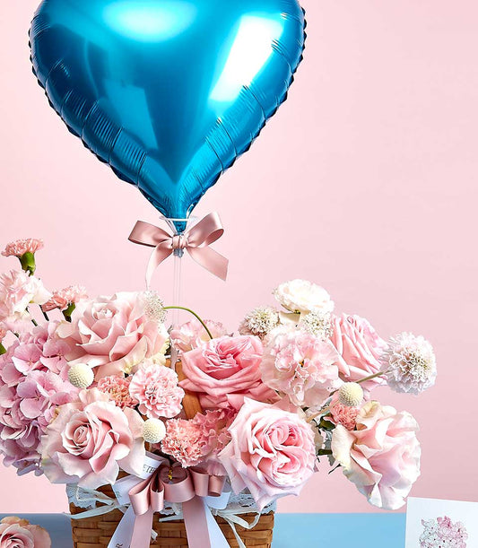 Pink rose and hydrangea basket with blue heart balloon, Mother's Day flowers by Basketeer