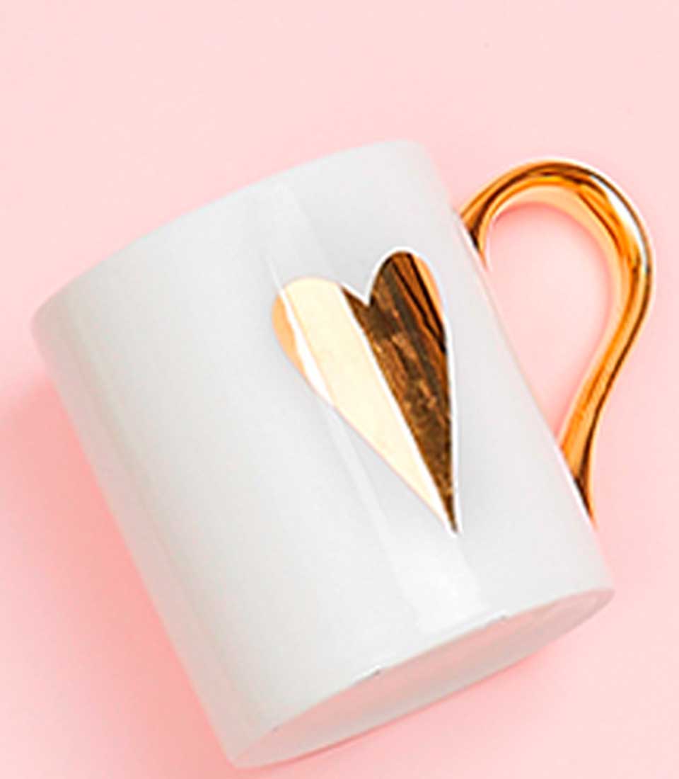 White ceramic mug with gold heart design and gold handle, Mother's Day gift