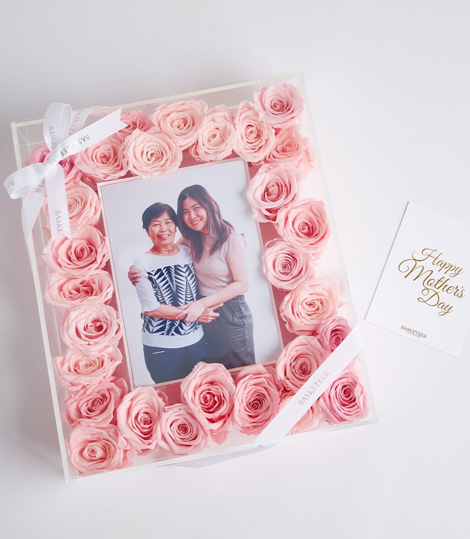 Pink preserved roses framing personal mother-daughter photo in luxury acrylic gift box, Mother's Day keepsake