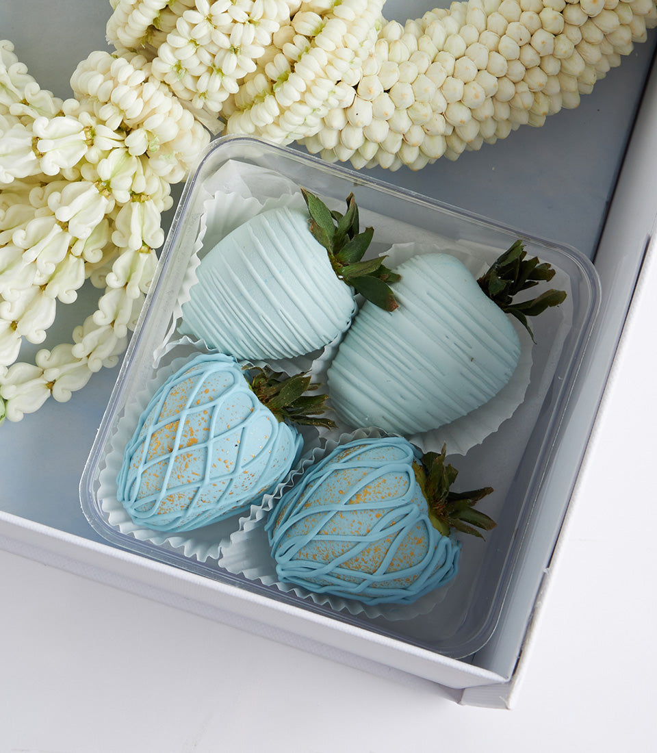 Light blue chocolate-covered strawberries with Thai jasmine garland in Mother's Day luxury gift box