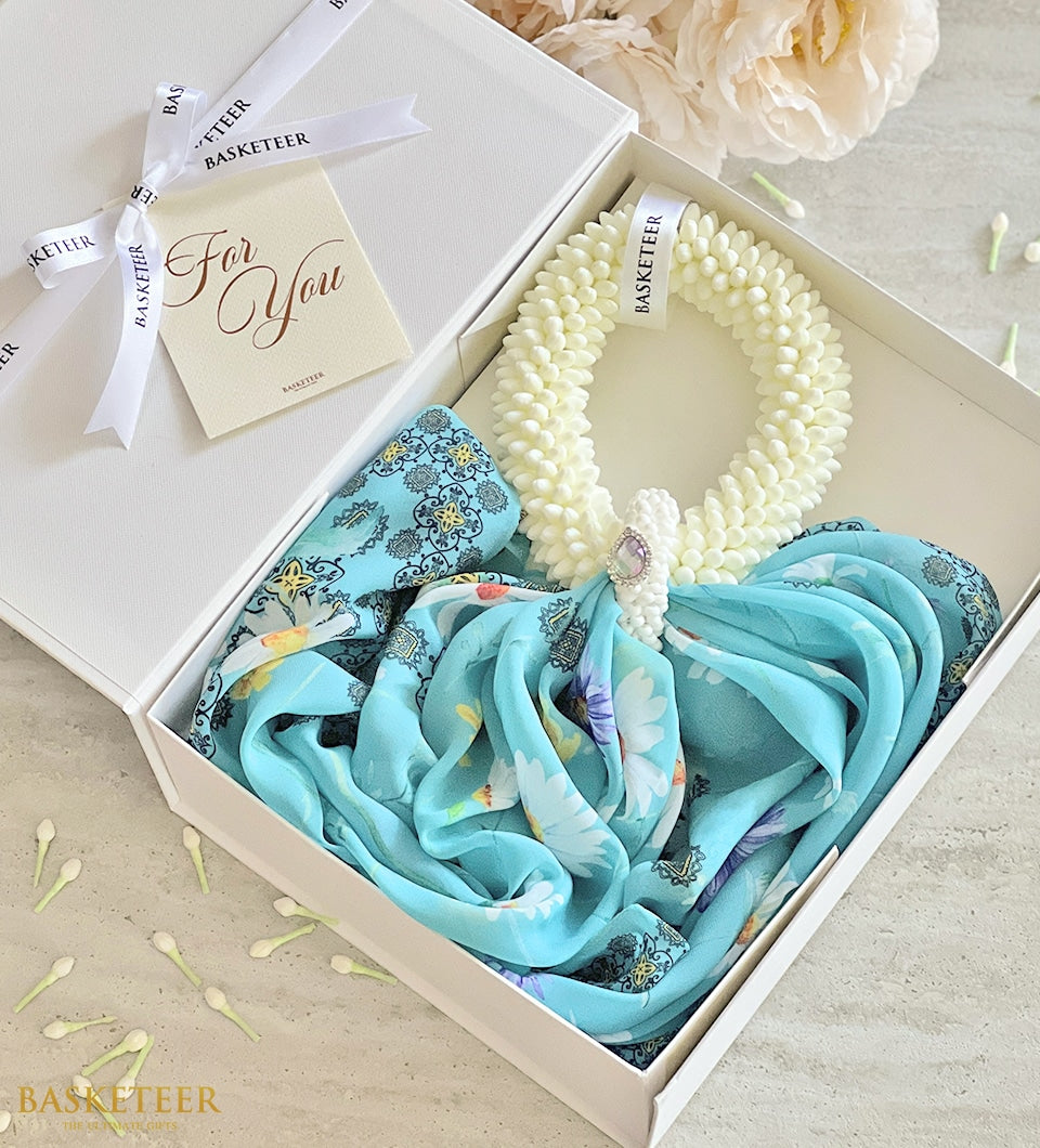 Light blue patterned scarf and white jasmine garland in luxury gift box with ribbon for Mother's Day