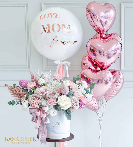 Luxury Mother's Day gift set with fresh pink and white roses, hydrangeas, carnations, heart balloons, and rose gold "Love