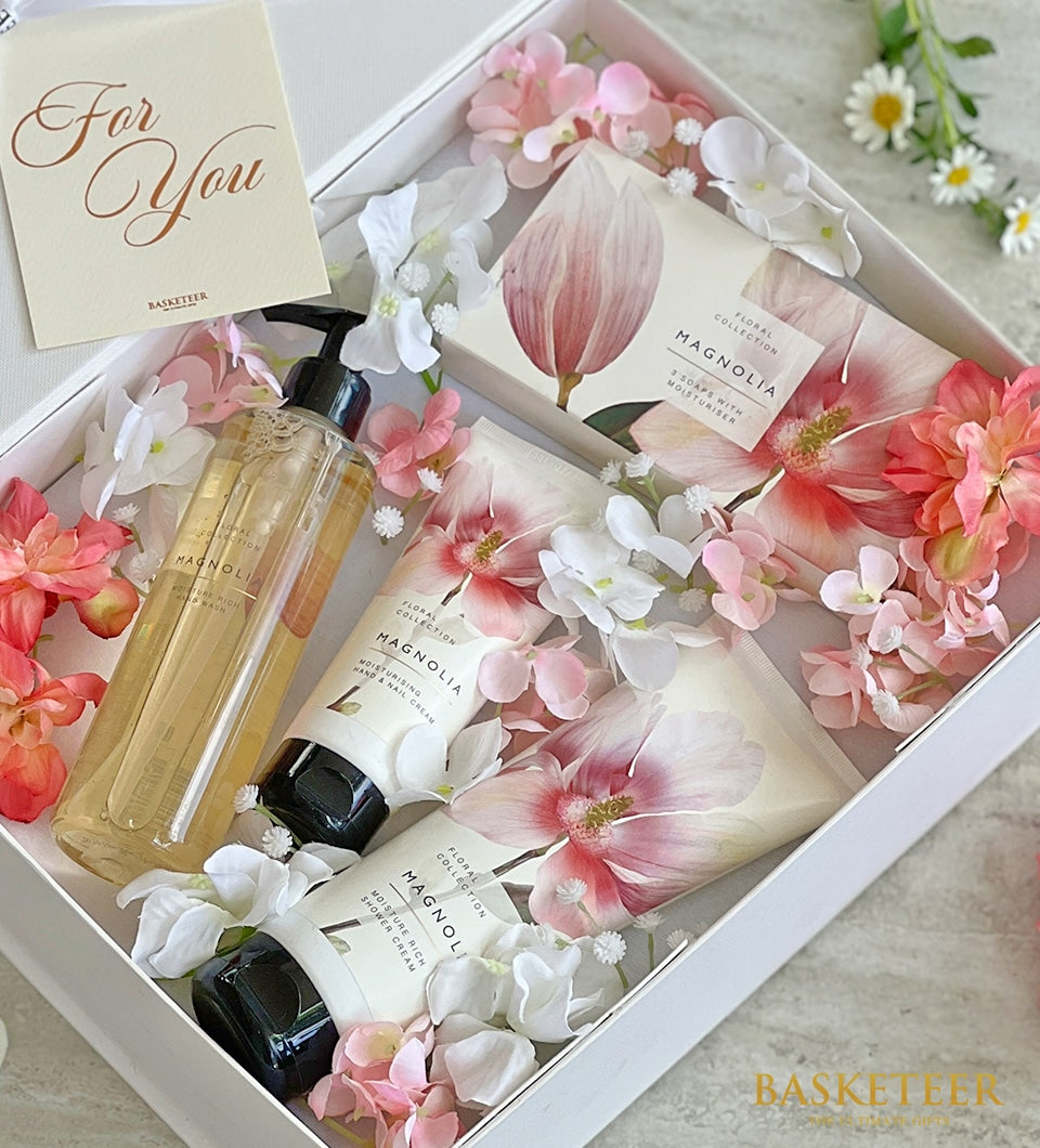 Magnolia-themed spa gift set with hand wash, shower cream, and soaps in white box with artificial flowers for Mother's Day