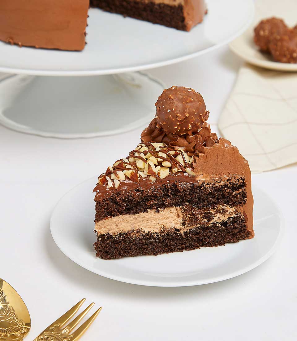Ferrero Rocher chocolate birthday cake with hazelnut filling, chocolate frosting, and candied top