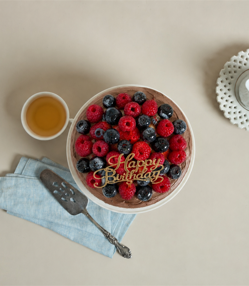Charlotte Bakery's artisan chocolate birthday cake, generously topped with fresh raspberries