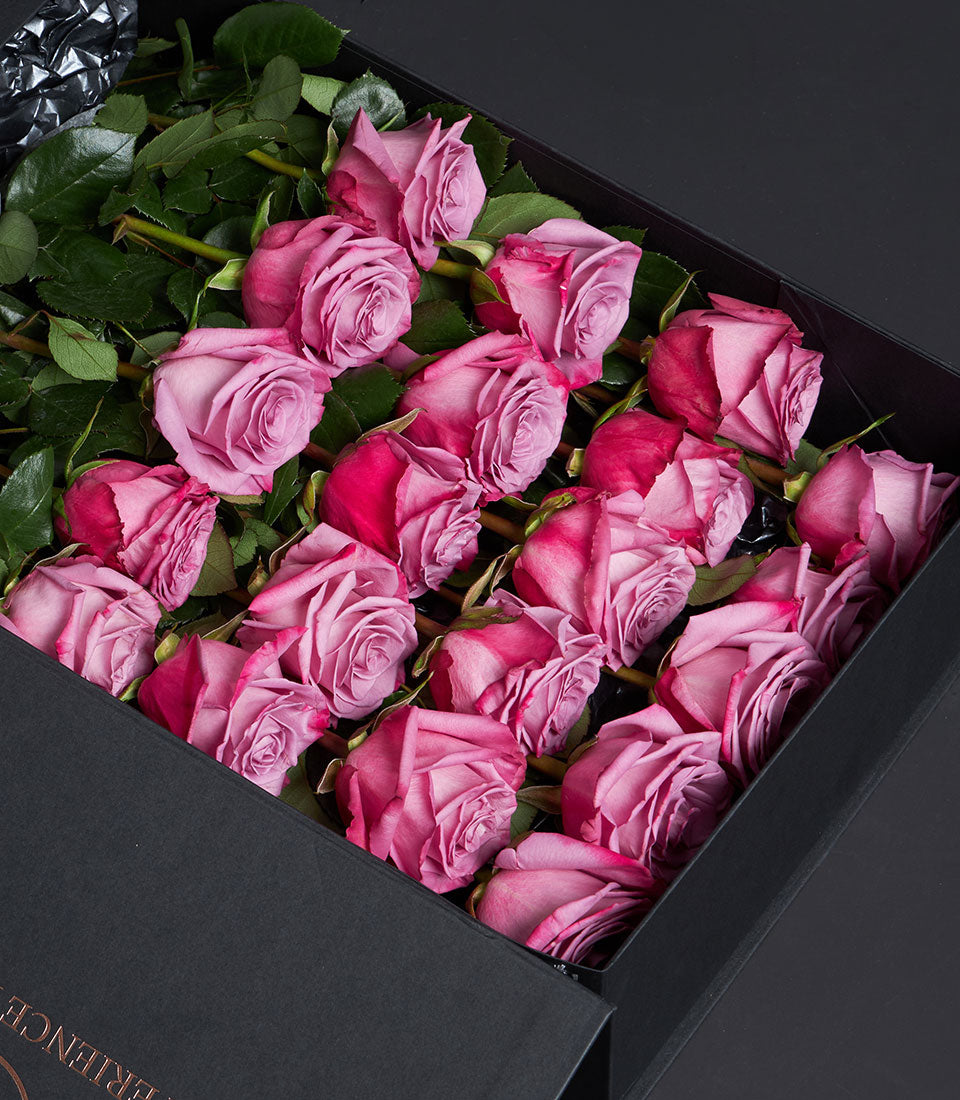 Luxury Valentine's Day pink and purple roses in sleek black gift box