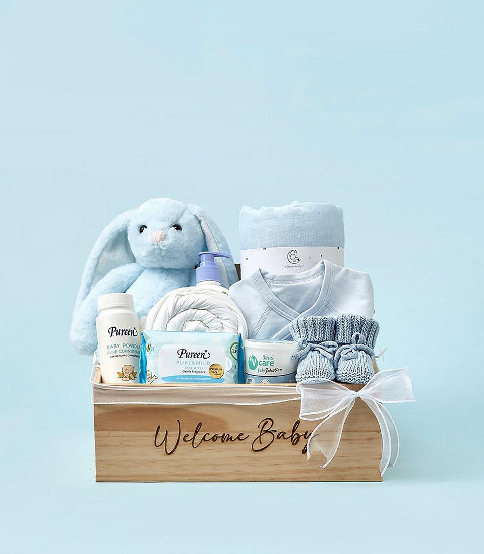 Welcome Baby wooden crate gift set with light blue bunny, baby essentials, and booties for newborns