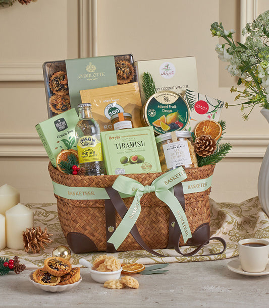 Green Harmony wicker gourmet basket with green tea, chocolates, and artisan treats for New Year gifting
