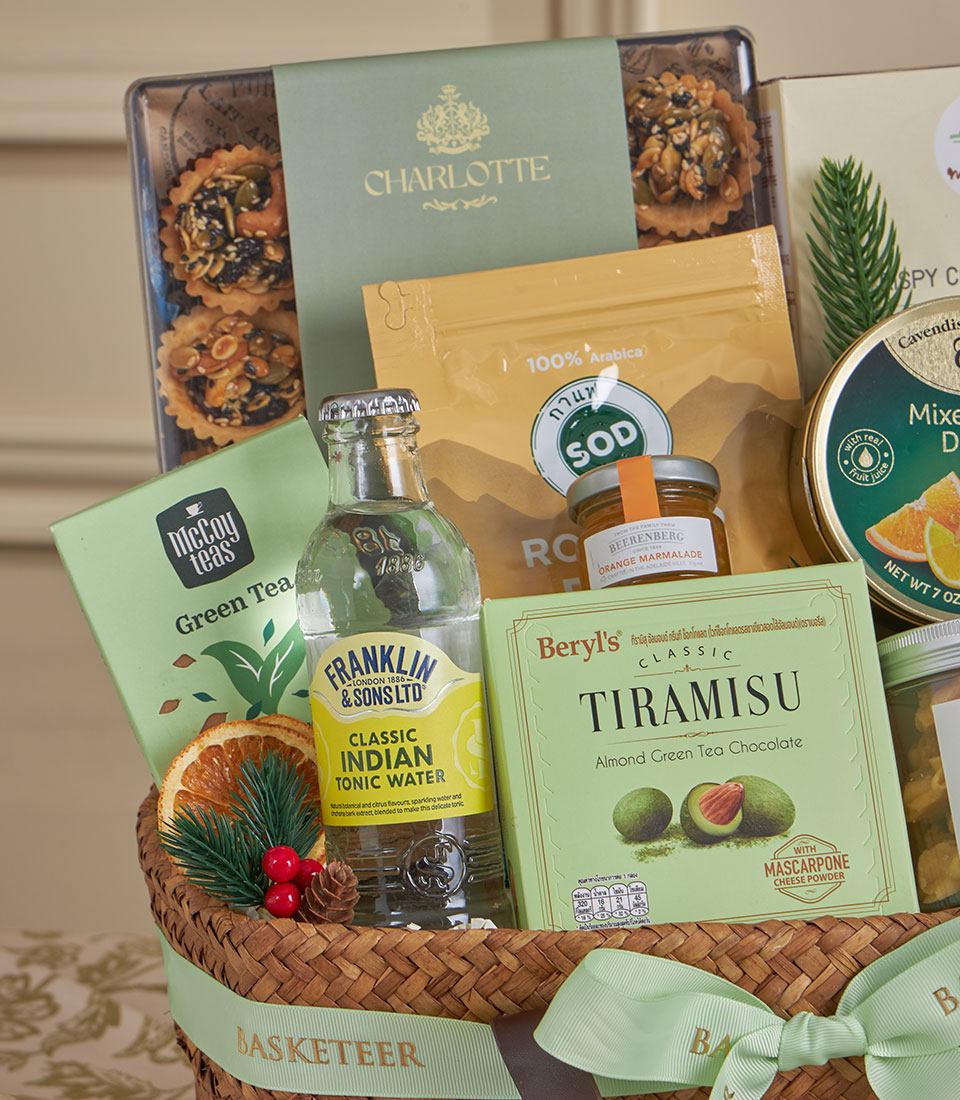 Green Harmony gourmet gift basket with green tea, Arabica coffee, tonic water, and artisan treats for New Year gifting