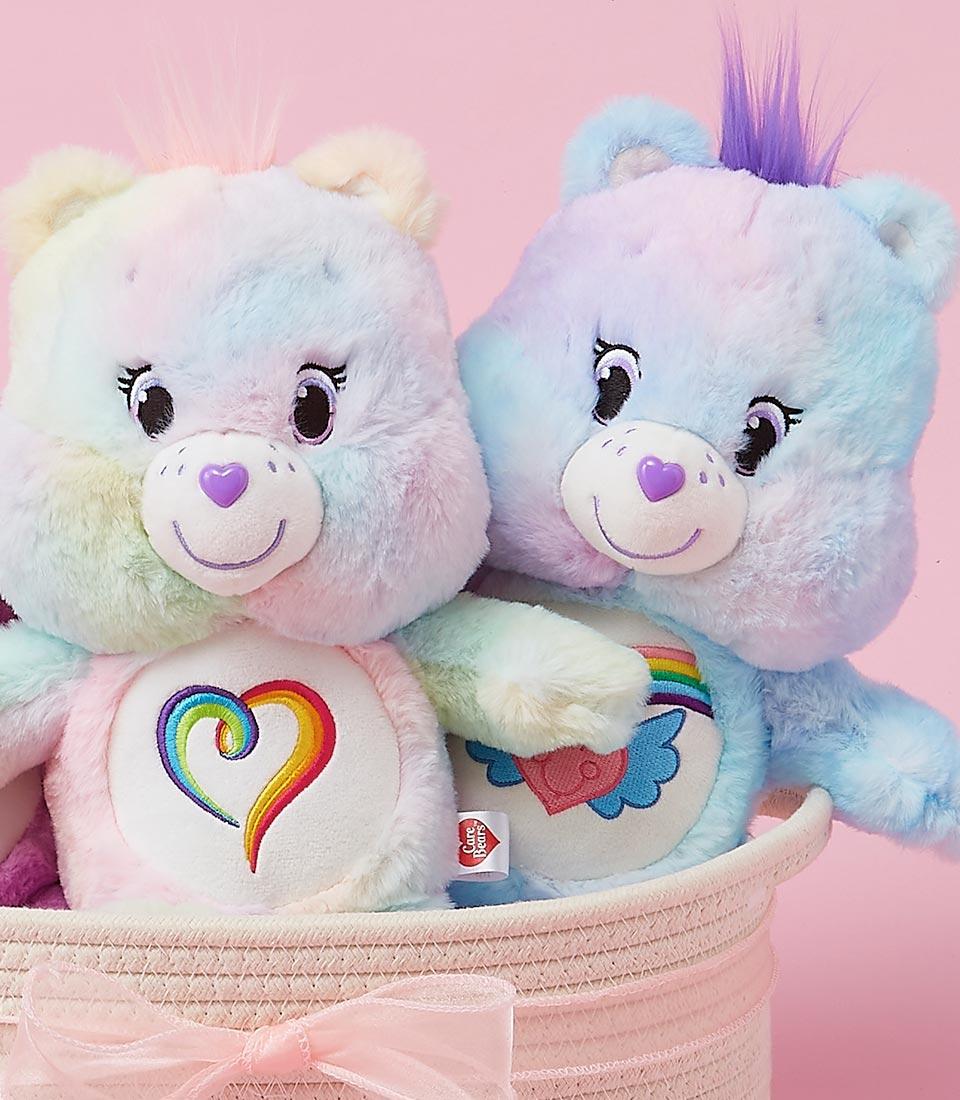 Pastel tie-dye plush bears with rainbow hearts in woven pink basket, perfect birthday gift for kids