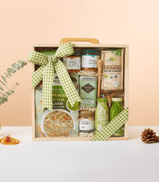Healthy Living Essentials gift box with organic rice cakes, lychee green tea, honey, matcha granola, and jasmine rice