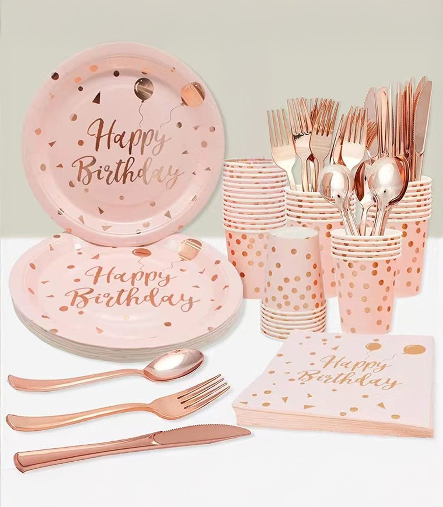 Rose gold and pink Happy Birthday party tableware set with plates, cups, napkins, and cutlery for ten