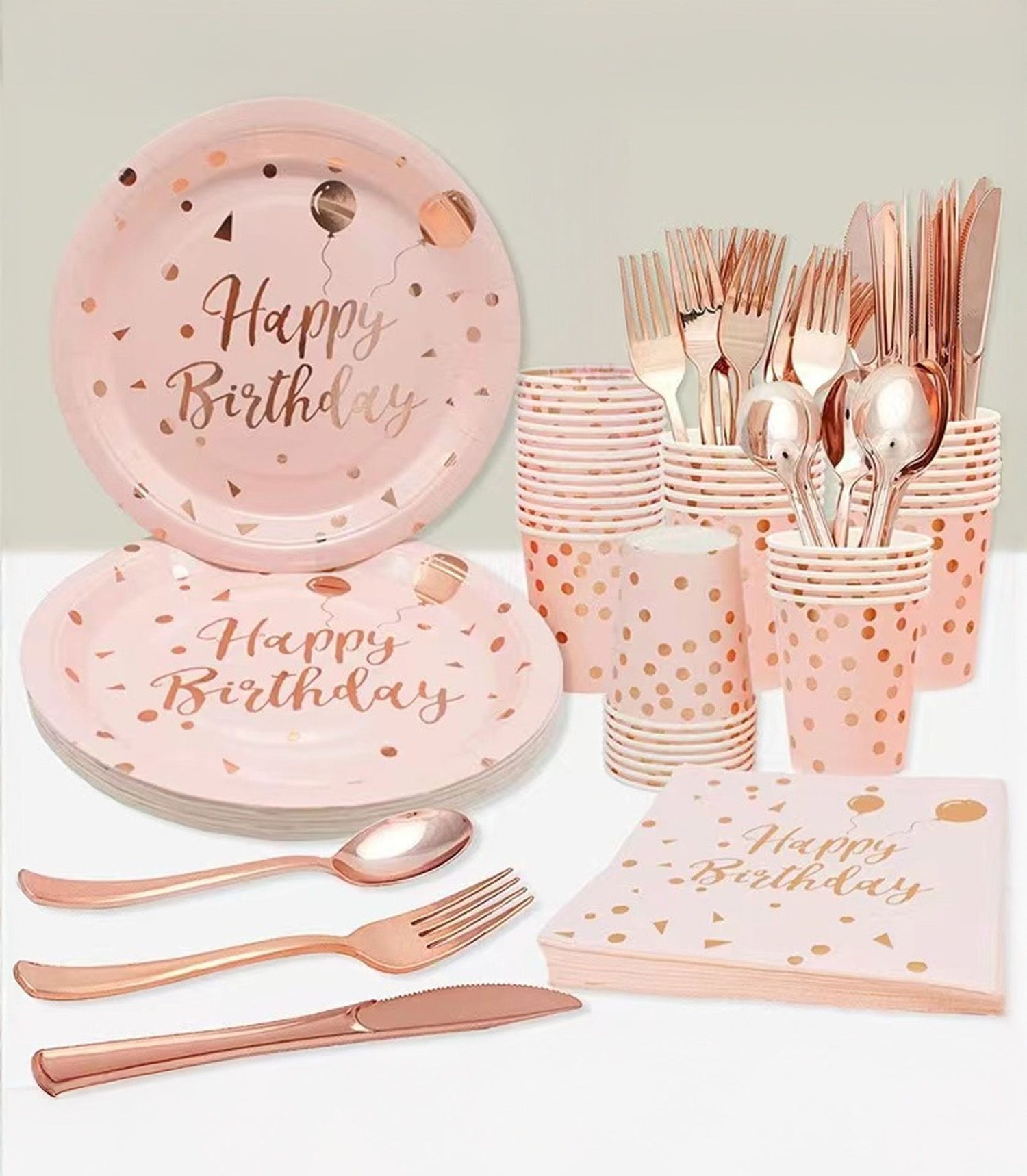 Rose gold and pink Happy Birthday party set with plates, cups, napkins, and cutlery for ten guests