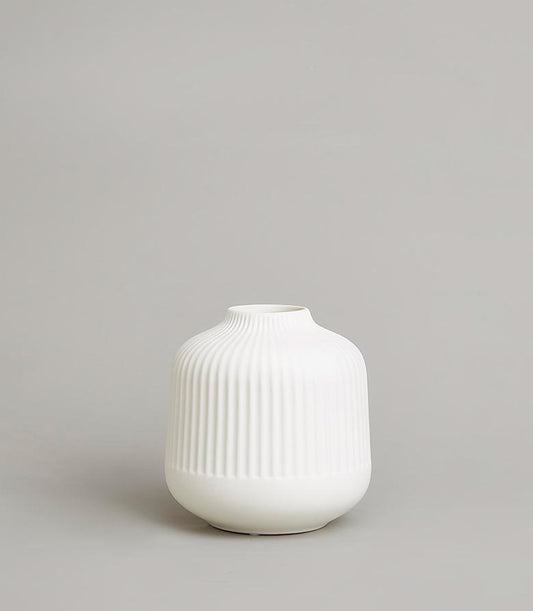 Minimalist ribbed white ceramic vase with tapered neck for fresh flowers or dried arrangements