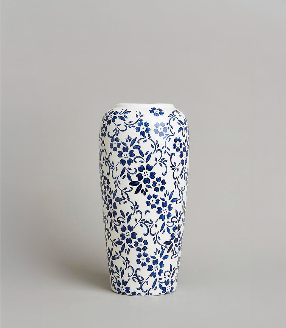 White ceramic vase with intricate blue floral vine pattern, heritage design luxury gift