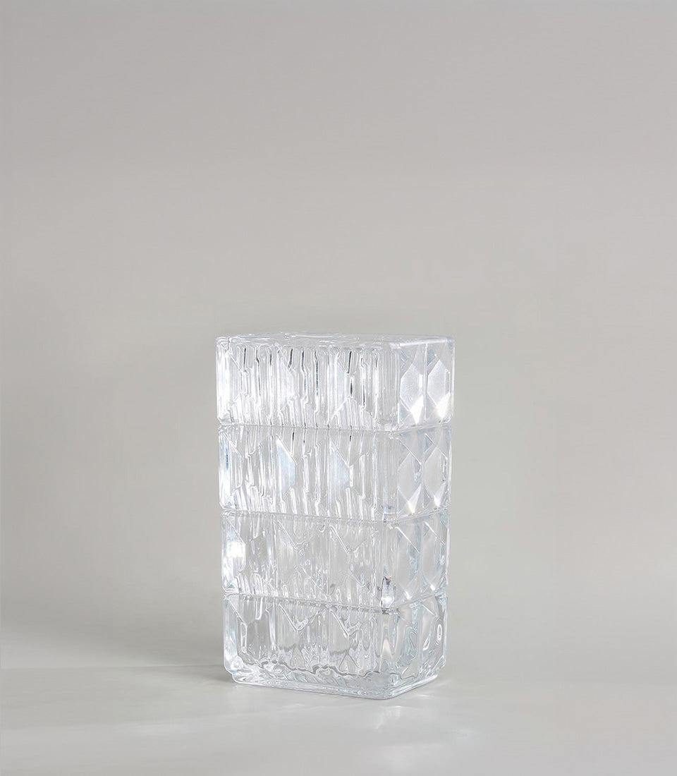 Geometric textured clear glass vase with carved diamond and faceted patterns