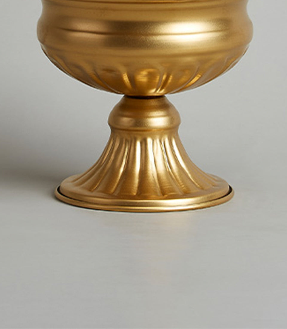Golden matte metal vase with fluted bowl and ridged pedestal base, luxury home decor