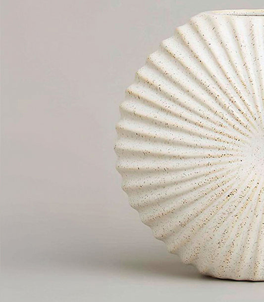 Cream ceramic vase with radial ridged pattern and speckled finish, artisan home décor gift