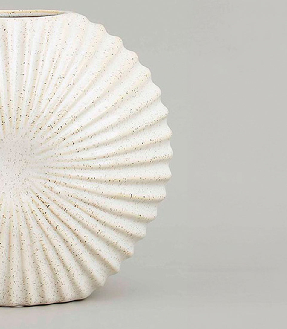 White textured ceramic vase with radiant ribbed design and speckled finish