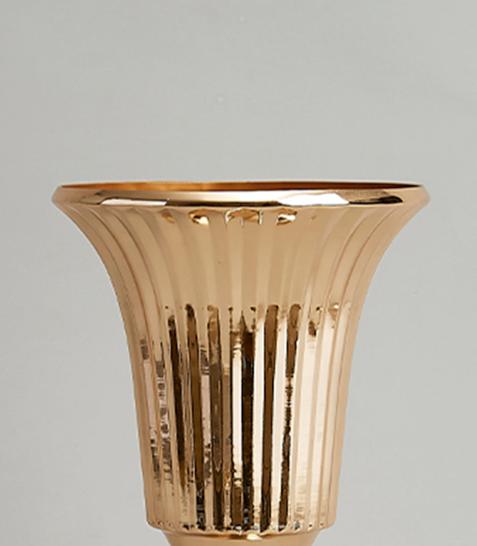 Golden fluted vase with polished metallic finish and elegant tapered design