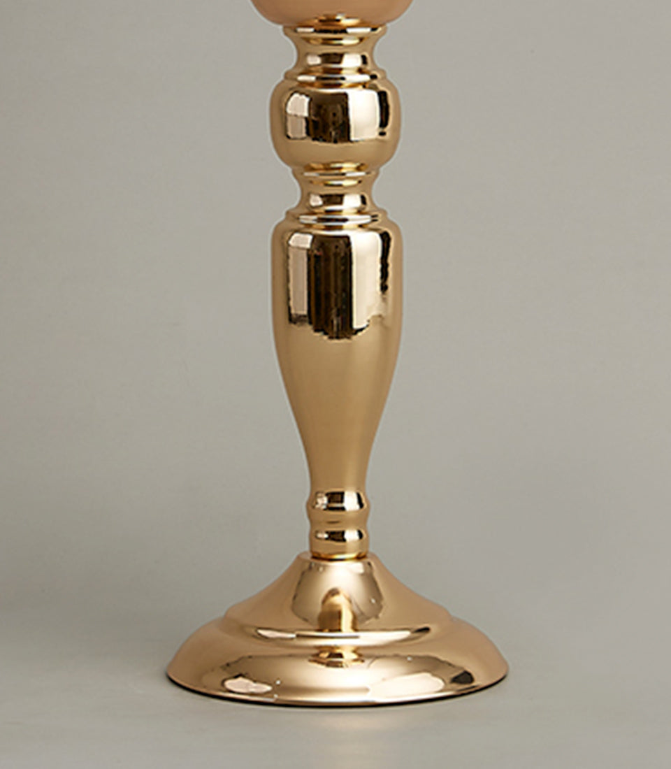 Polished gold metal ornate vase centerpiece with stacked turned design and stepped circular base