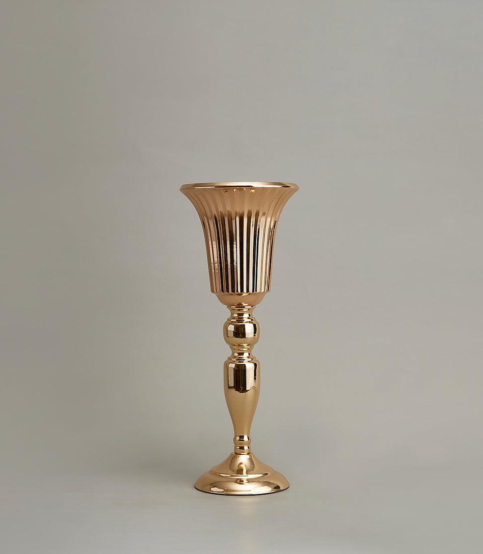 Tall golden fluted vase with spherical stem details and polished metallic finish