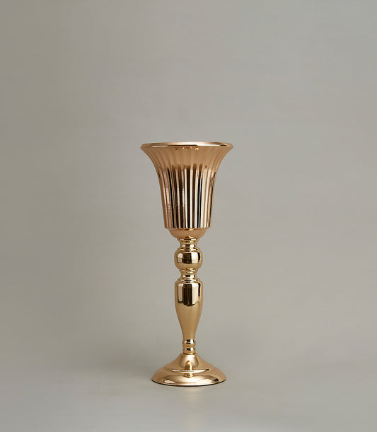 Tall golden fluted vase with spherical stem details and polished metallic finish