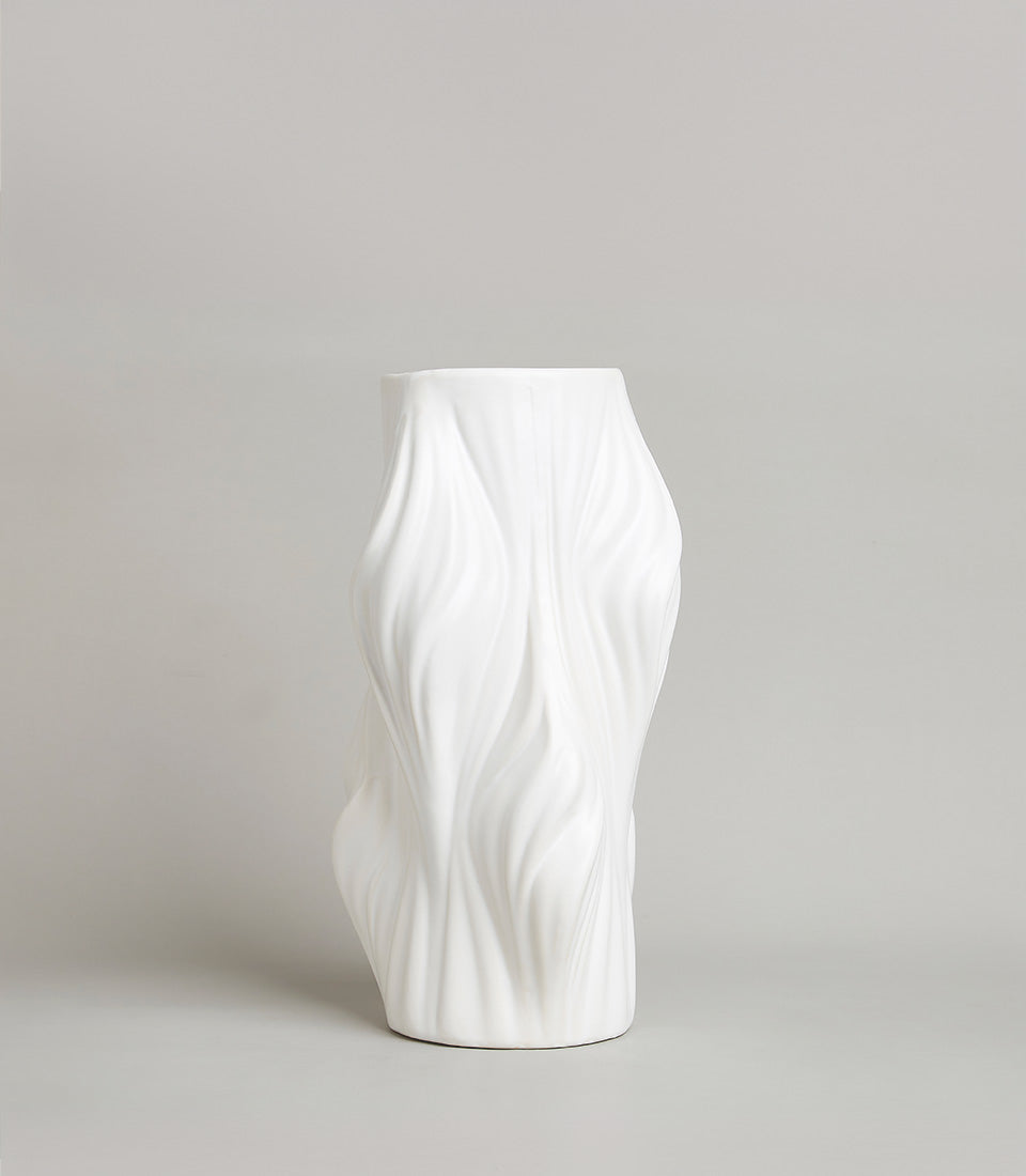 White ceramic vase with flowing wave-textured sculptural design for premium home gifting