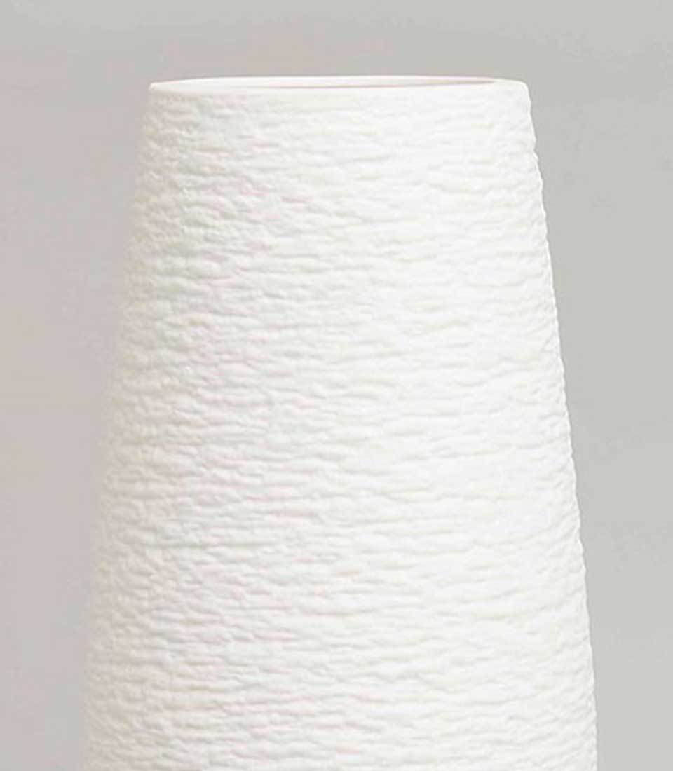 Textured tapered white ceramic vase with horizontal ridge detailing