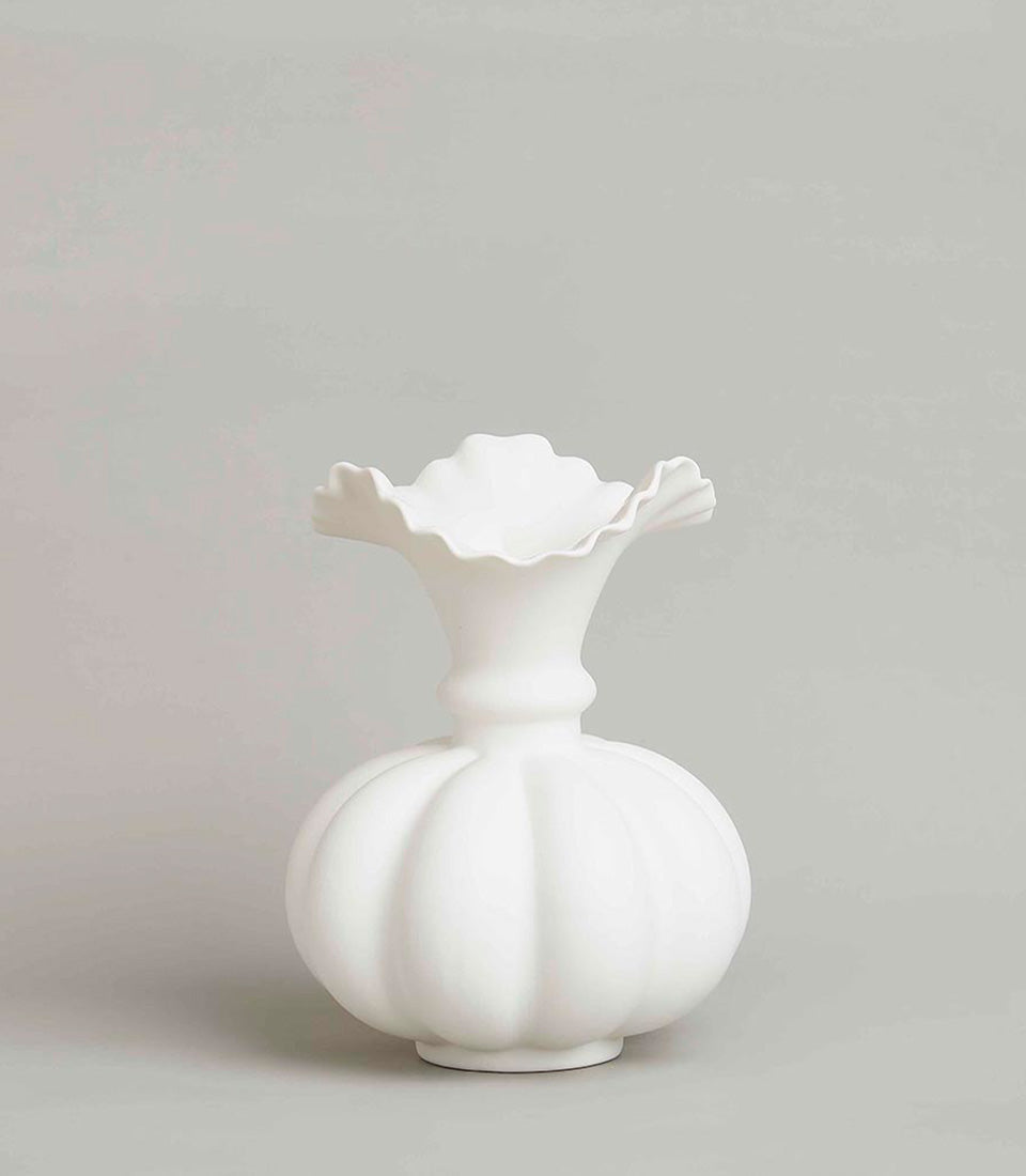 White ceramic sculptural vase with ruffled rim and ribbed pumpkin body