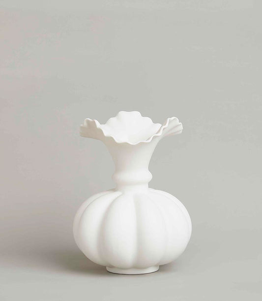 White ceramic sculptural vase with ruffled rim and ribbed pumpkin body