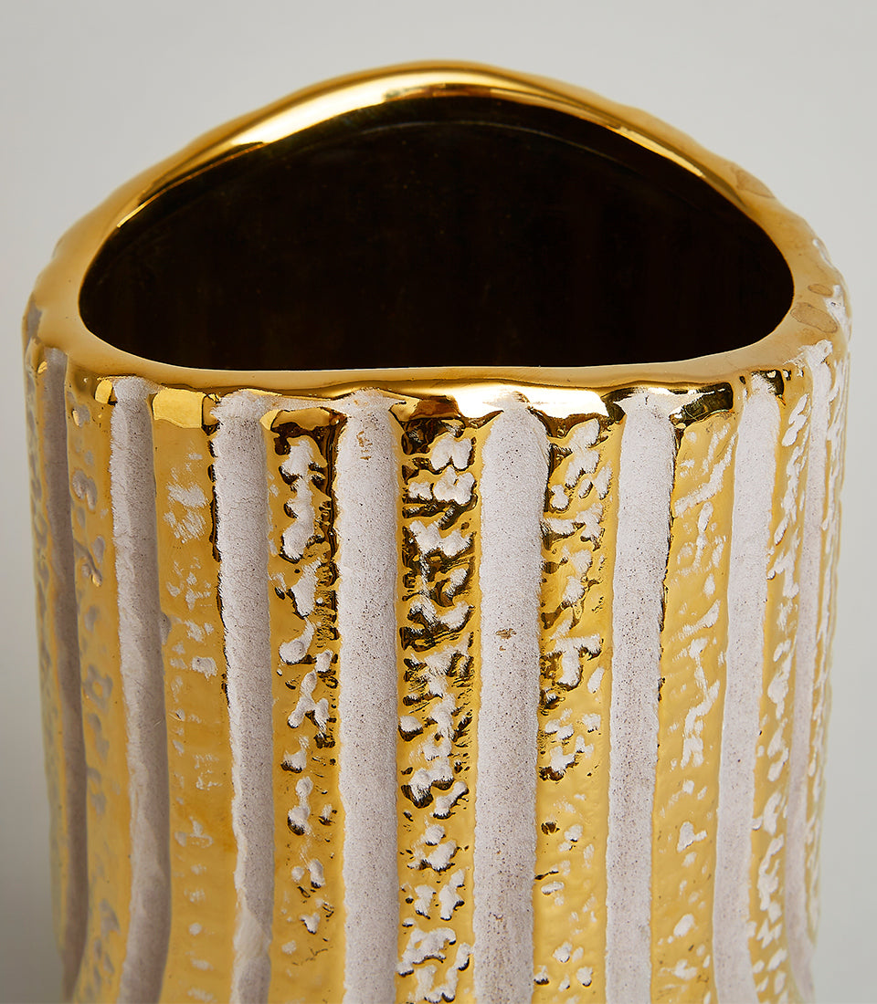 Gold and cream striped decorative vase with hammered metallic finish